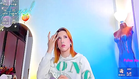 Red haired lingerie babe with a tattoo on her chest