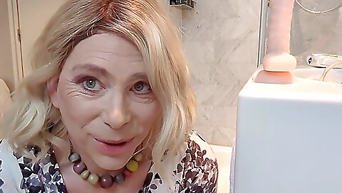 Busty milf in hotel room drills her anal with dildo