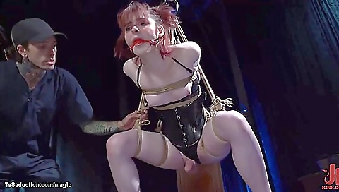 Red-haired bitch is hanging upside down on a dildo