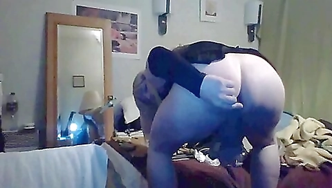 Mature transvestite in a white blouse and skirt is anal